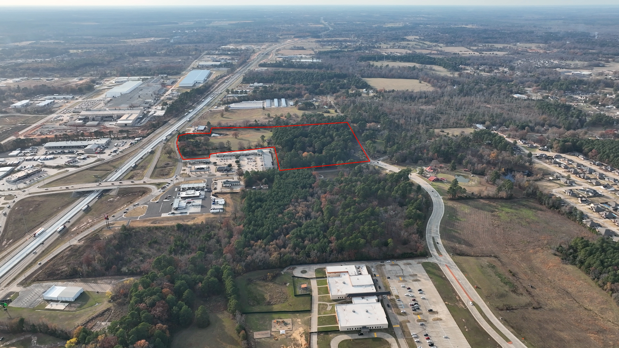 Aerial view of 32-acre parcel at Kings Highway and I-30, outlined in red